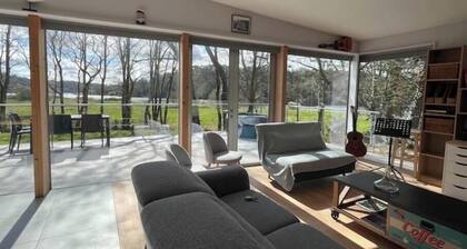 Architectural wooden house with spa on the banks of the Vilaine river