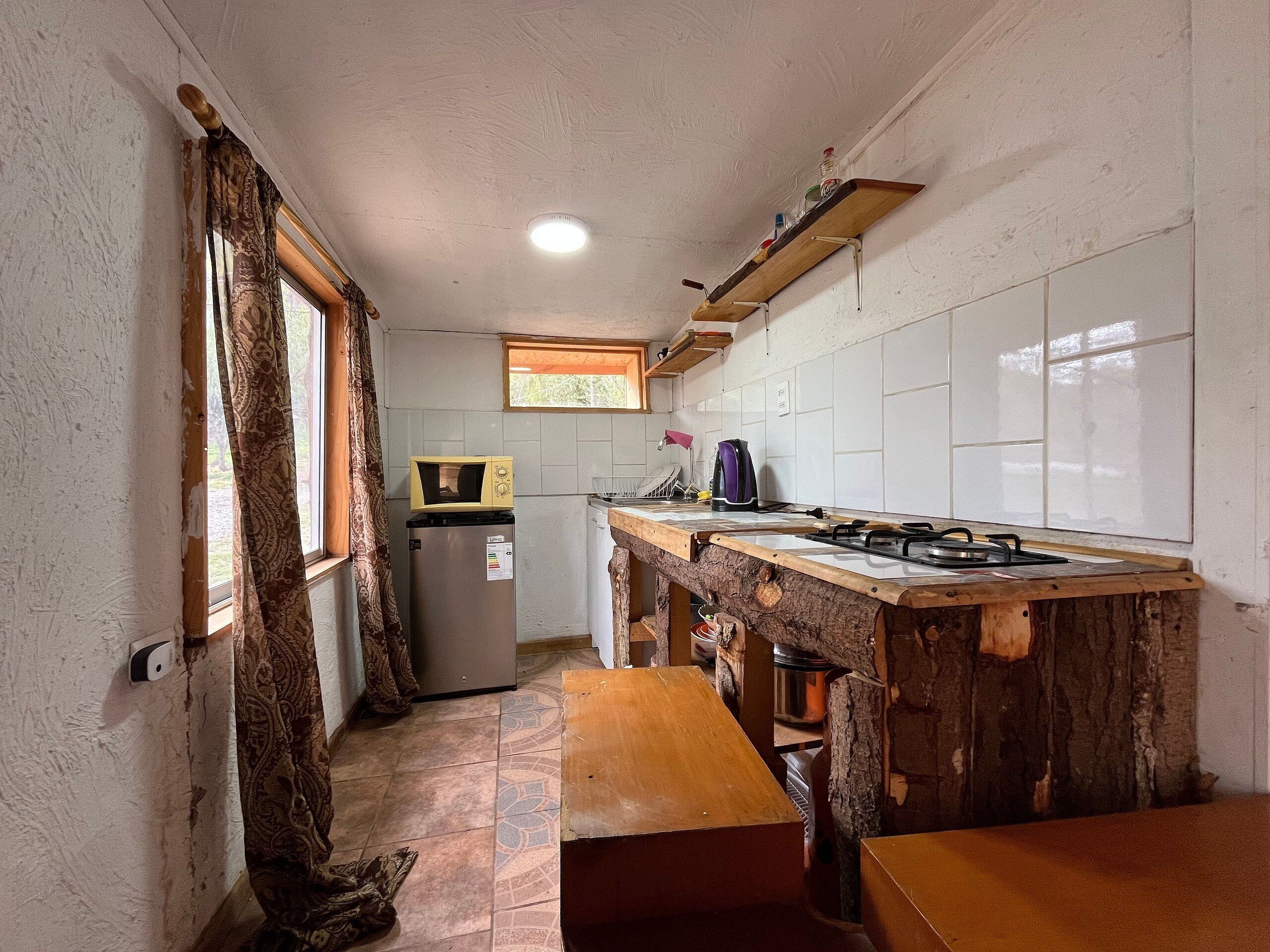 Cabin | Private kitchen | Fridge, microwave, cookware/dishes/utensils