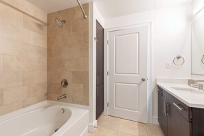Shower, hair dryer, towels - Modern Apt Heart of Seaport (Boston, MA)