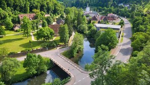 A riverside village with traditional houses, a bridge, and a church. - Boardinghaus Wildberg - Fitter's room near Nagold & Calw (Wildberg)