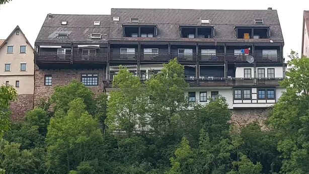 A multi-story building with balconies, surrounded by dense greenery. - Boardinghaus Wildberg - Fitter's room near Nagold & Calw (Wildberg)