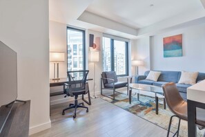 TV, offices - Seaport Retreat - Rooftop Pool & Gym (Boston, MA)