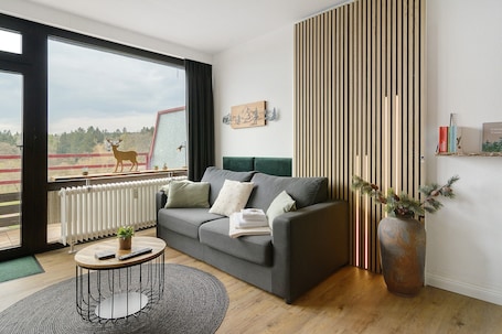 TV. Apartment 'Panoramablick Hahnenk' with Sea View, Wi-Fi and Air Conditioning