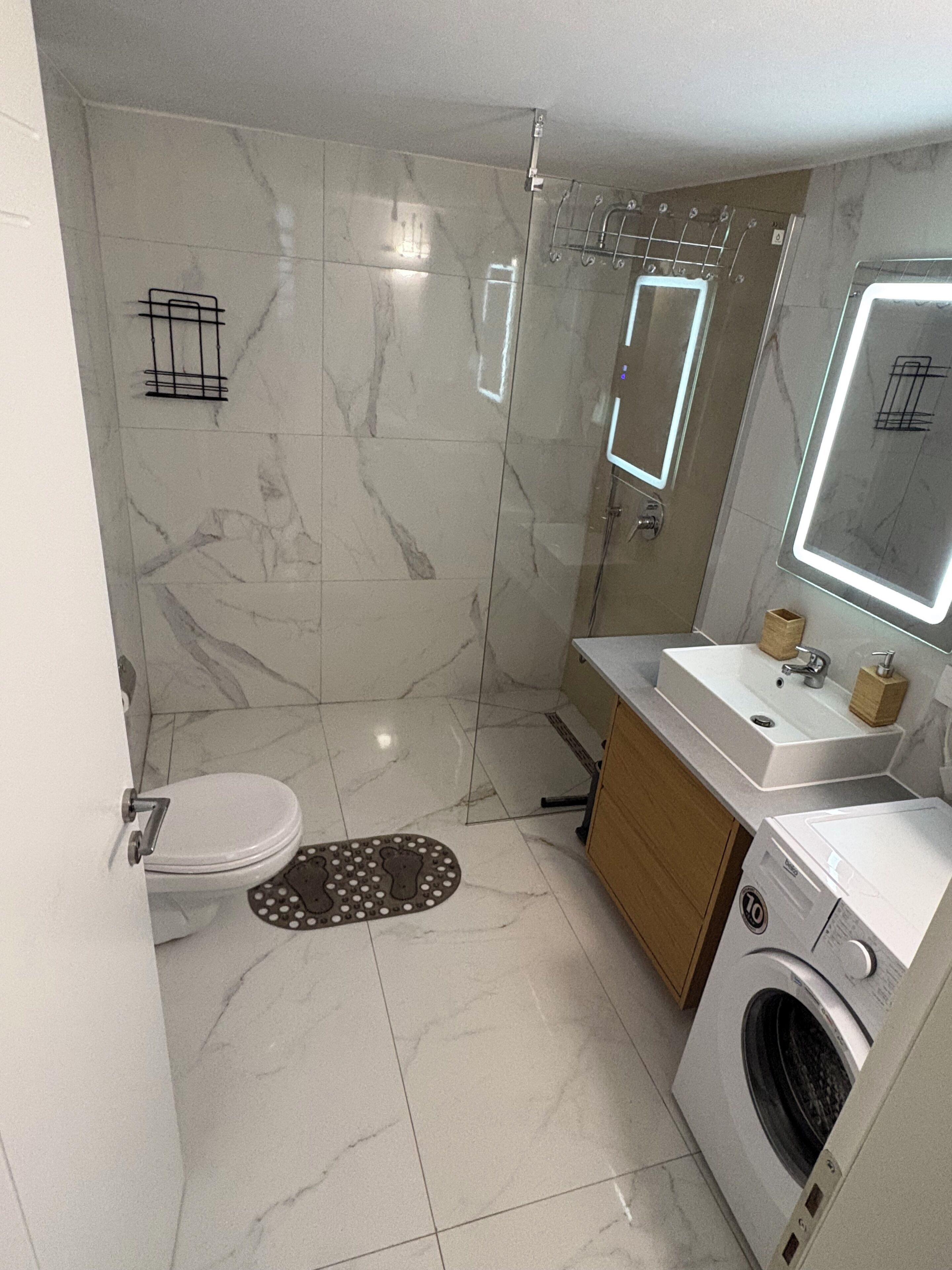 Shower, hair dryer, towels, toilet paper