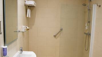 Hair dryer, towels, shampoo, toilet paper