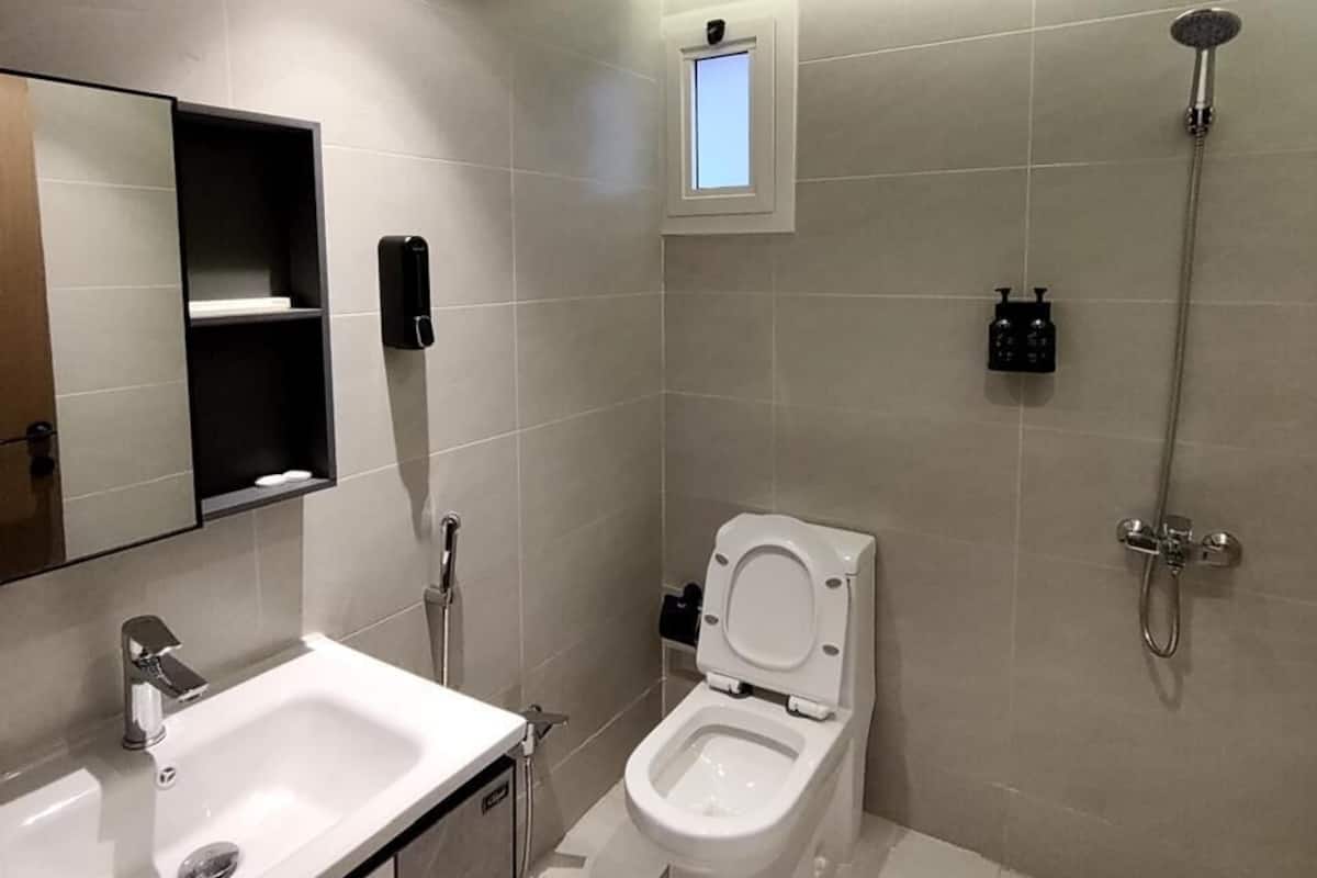Separate bathtub and shower, rainfall showerhead, designer toiletries