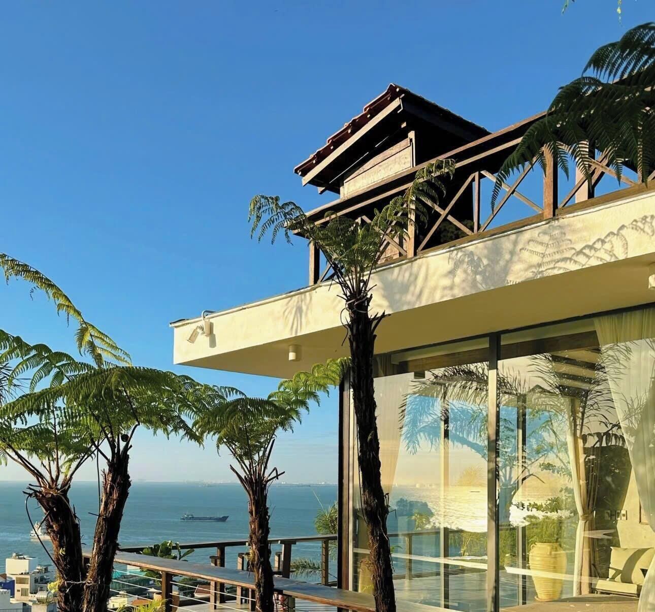 Habitación cuádruple Deluxe, balcón, vista al mar | Terraza o patio