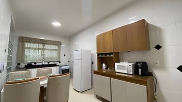 Fridge, microwave, oven, cookware/dishes/utensils