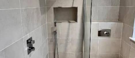 Shower, towels, soap, toilet paper