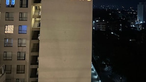 A building with a sign reading 'TSAVO' at night.