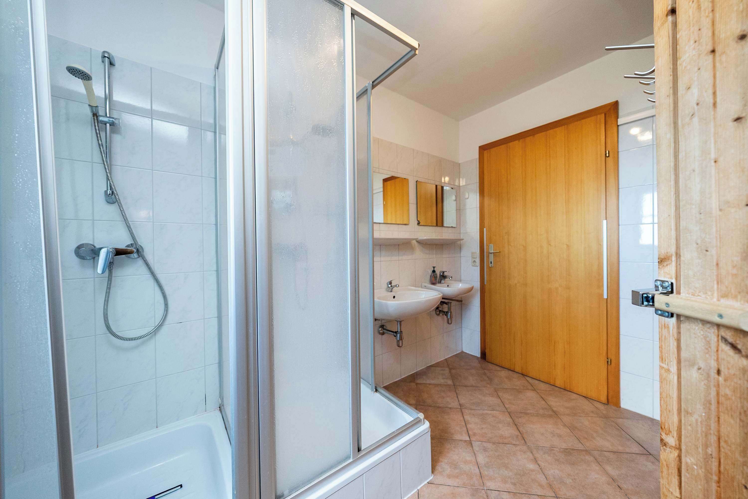Shower, hair dryer, towels, shampoo