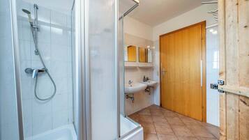 Shower, hair dryer, towels, shampoo