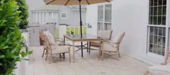 Resort style 5-bedroom lake house with white sand beach, pool, and pool house.