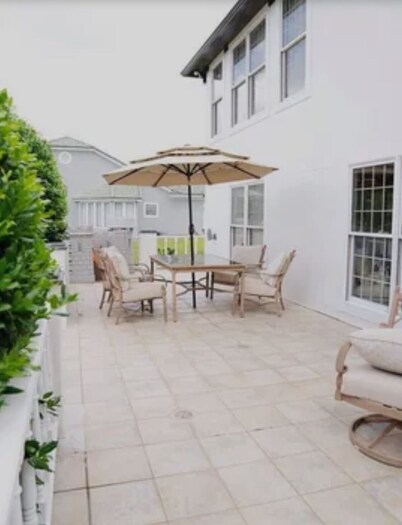 Resort style 5-bedroom lake house with white sand beach, pool, and pool house.
