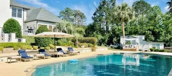 Resort style 5-bedroom lake house with white sand beach, pool, and pool house.