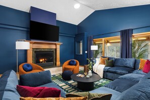 Smart TV, fireplace, table football, books