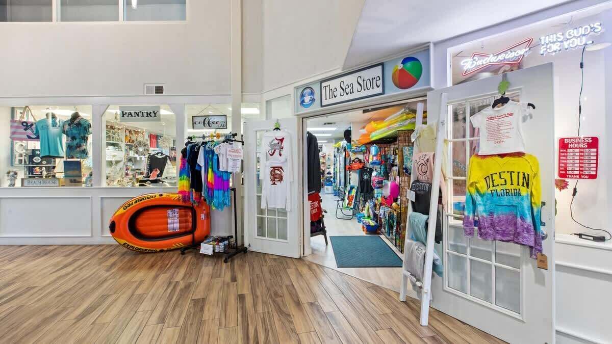 A store interior with multiple shops, including 'The Sea Store' and 'Pantry'.