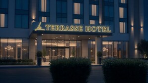 The exterior of the Terrasse Hotel with a modern facade, large windows, and a prominent entrance. - La Terrasse Hotel (Jeddah)