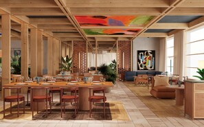 Un comedor espacioso con vigas de madera, una gran mesa dispuesta para seis comensales y un vibrante cuadro abstracto en el techo.
