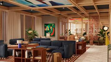 Un moderno vestíbulo de hotel con un sofá modular, estanterías de madera, un cuadro abstracto de gran tamaño y un techo decorativo.
