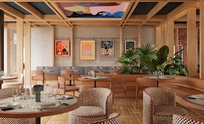 A restaurant interior with round tables, checkered chairs, and artwork on the walls. - Cuber House Valencia, Curio Collection By Hilton (Valencia)