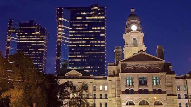 A historic building with a clock tower, surrounded by modern high-rise buildings. - Private Fort Worth Getaway Near Stockyards & Zoo! (Fort Worth)