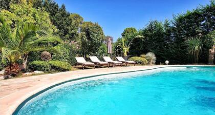Low villa with pool in a green setting