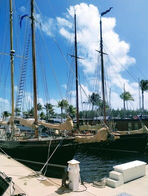 A marina with several sailboats docked, a lifebuoy, and a white gas pump on the dock. - 3bedrm Sailboat Located in a Luxury Resort Village w all the Amenities Included (Key West)