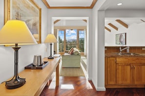 A modern kitchen with wooden cabinets, a countertop, and a sink. - Luxury 2BR Penthouse with Lodge Pool Access in Suncadia Resort (Cle Elum)