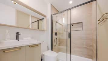 Shower, hair dryer, towels, shampoo