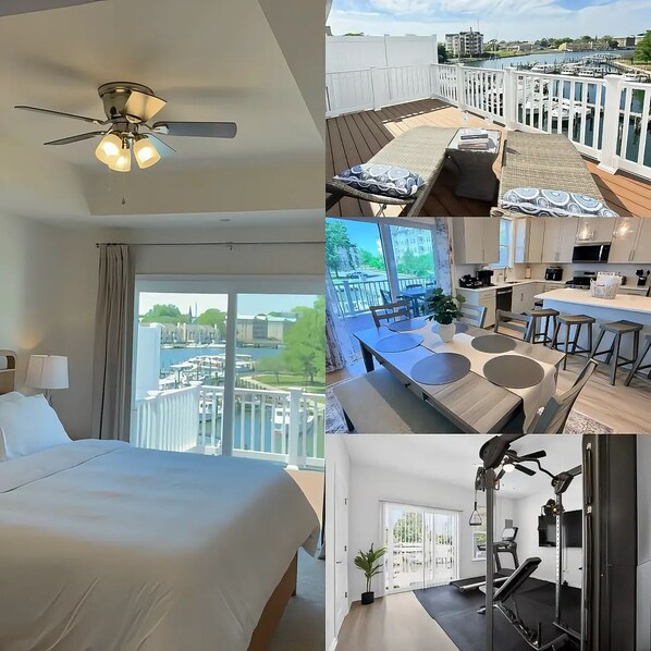 A hotel room with a bed, a ceiling fan, and a view of a marina. - Waterfront • Heated Decks • Workspace • EV Charging • Home Gym • Downtown (Cambridge)