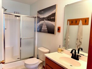 Shower, towels, soap, toilet paper