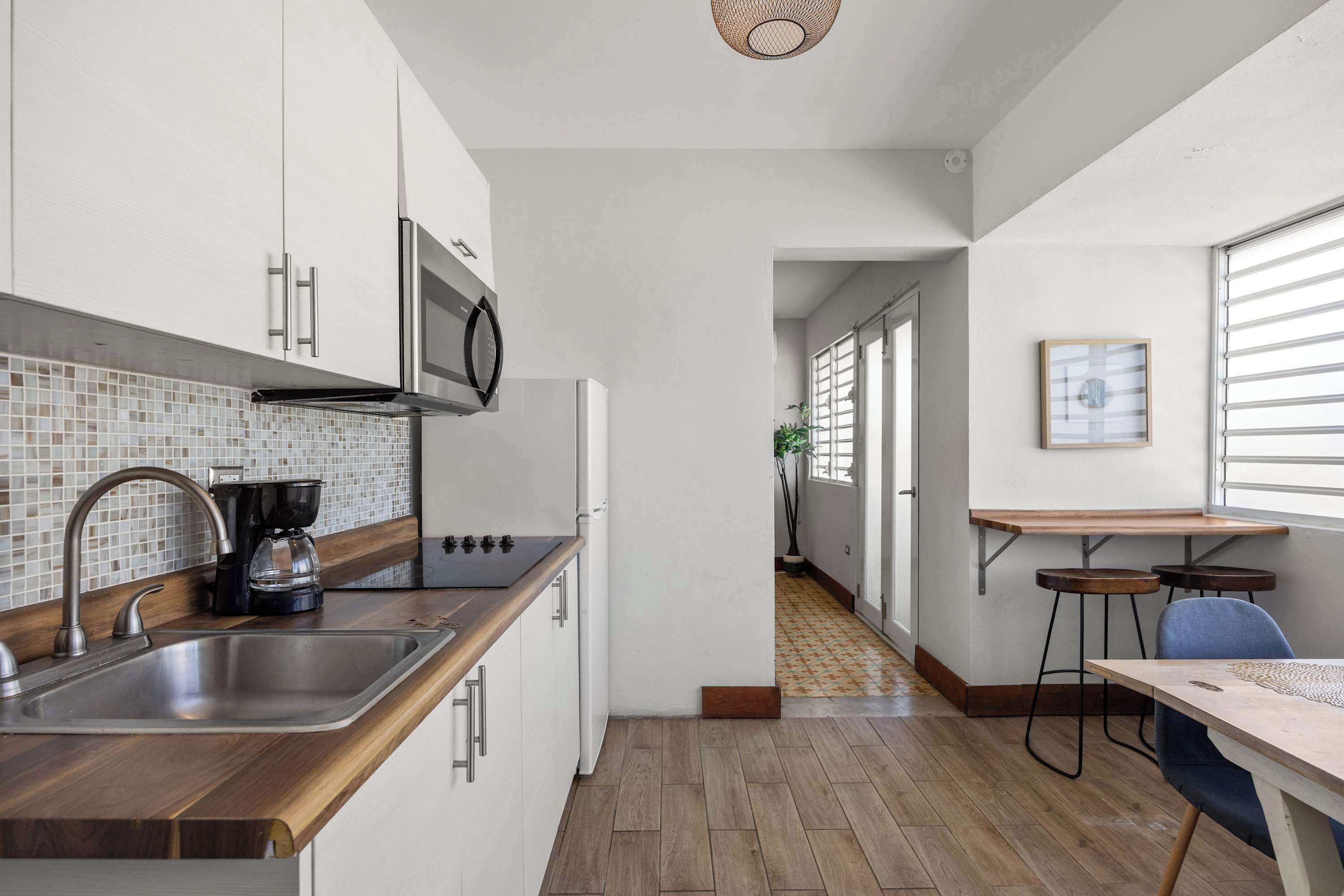 Fridge, microwave, stovetop, coffee/tea maker