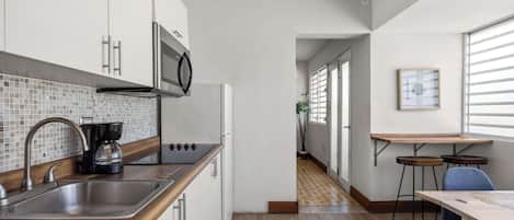 Fridge, microwave, stovetop, coffee/tea maker