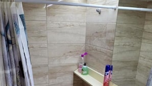 A bathroom with a shower, toilet, and a mirror. - Cozy apart Kontouli - Perfect studio apartment-5 min walk from Acropolis (Athina)
