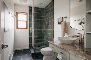 Shower, hair dryer, towels, shampoo