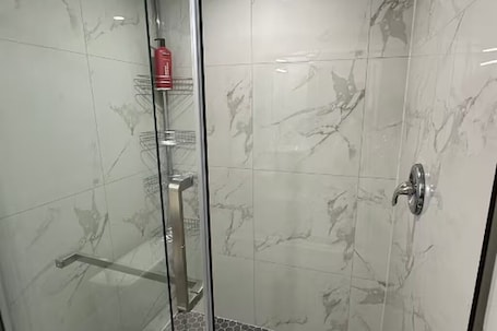 Shower, hair dryer, towels, soap. Cozy 3 bedroom Basement Suite