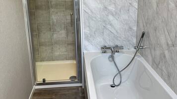 Shower, hair dryer, towels, soap