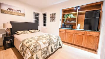 Tabla de planchar con plancha, wifi y ropa de cama
