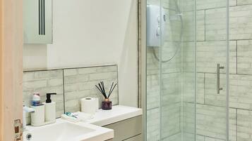 Shower, hair dryer, towels, soap