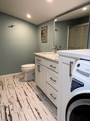 Shower, towels, soap, toilet paper