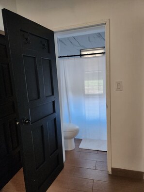 Shower, towels, soap, toilet paper