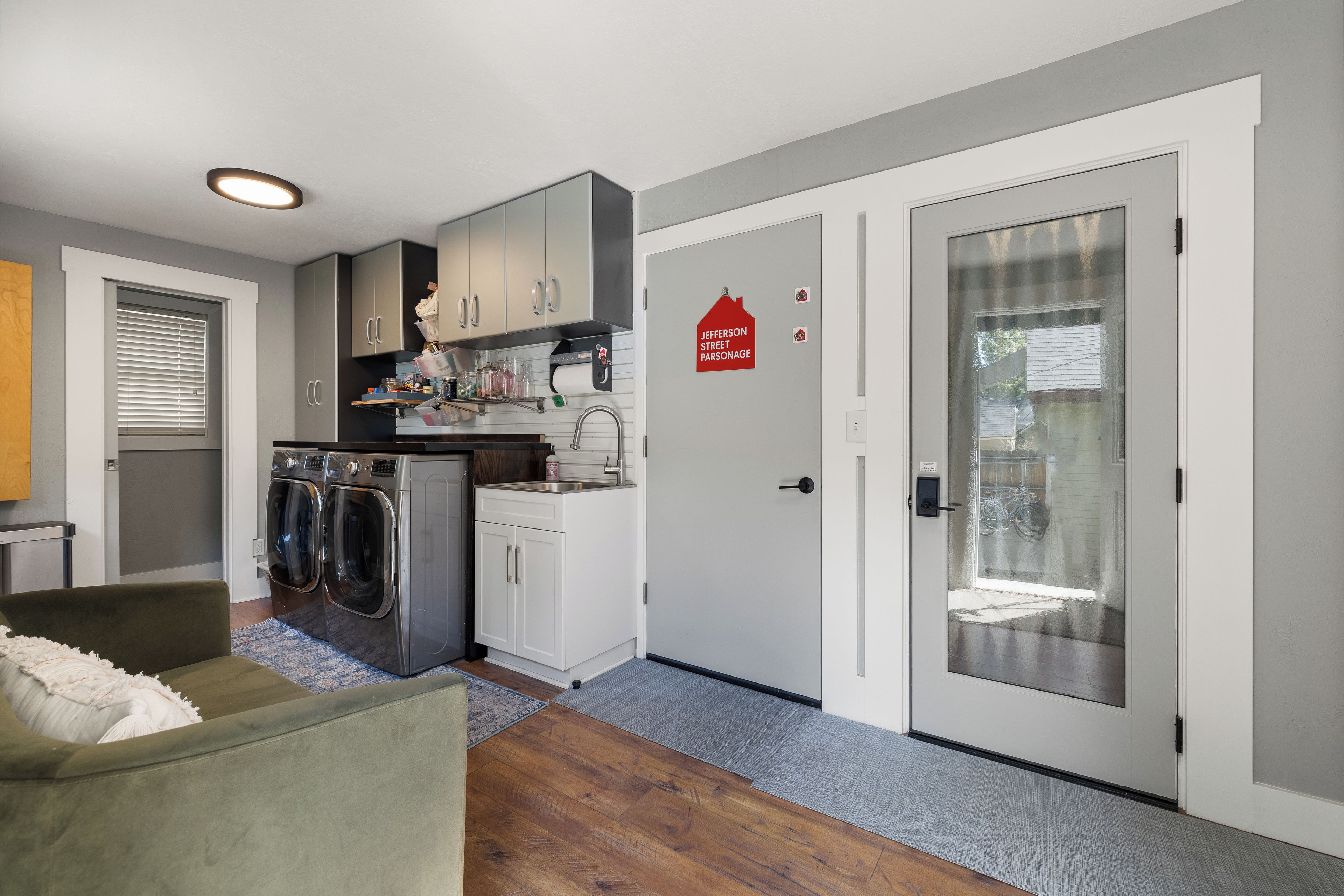 A compact kitchen with modern appliances, a built-in oven, and a small countertop.
