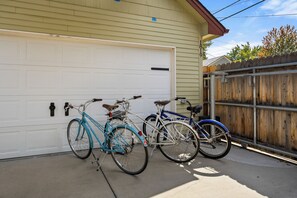 A garage with two bicycles parked inside.