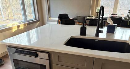 Relaxing 2 bedroom home on the Trout River views of historic train trestle.