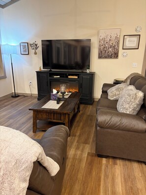 TV, fireplace -  Relaxing 2 bedroom home on the Trout River views of historic train trestle. (Malone)