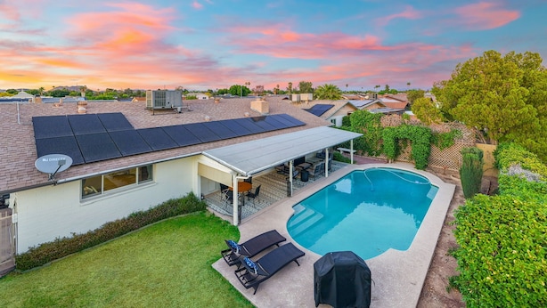 A residential area with a swimming pool, solar panels, and a covered patio. - Private Pool Paradise ~ 3BR Glendale Gem! (Glendale)