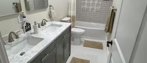 Shower, hair dryer, towels, soap