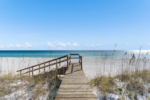 A wooden boardwalk leading to a beach with clear skies. - Pelican Dive – Luxury Gulf-Front Home - Private Walk-Over - Chefs Kitchen & Bar (Navarre)
