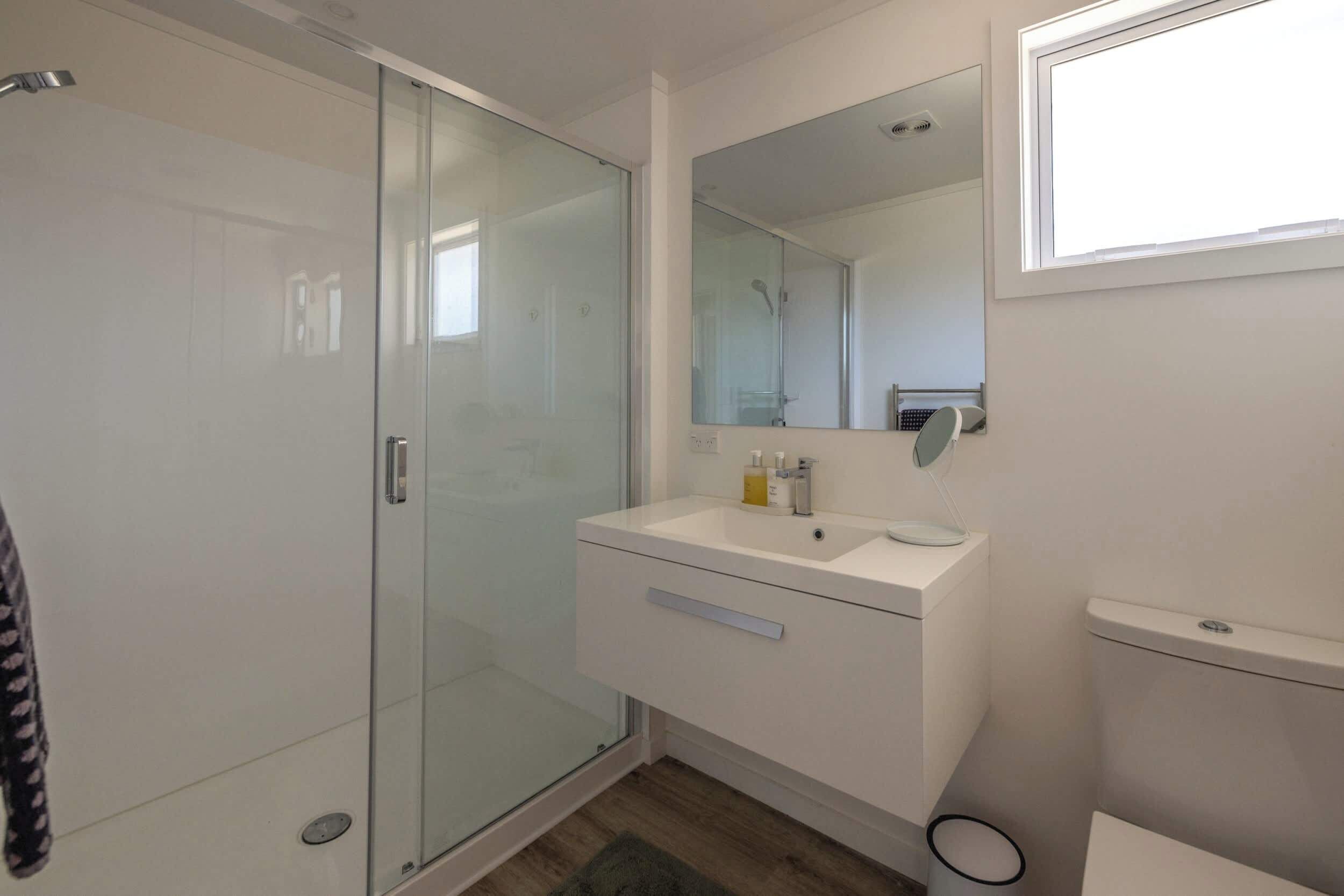 Shower, hair dryer, towels, shampoo